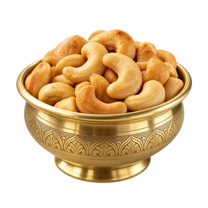 Illustrative roasted cashews in a brass bowl